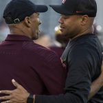 Arizona State head coach Herm Edwards, left, and Stanford head coach Dave Shaw hug before the first half of an NCAA college football game Thursday, Oct. 18, 2018, in Tempe, Ariz. (AP Photo/Darryl Webb)