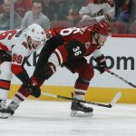 Arizona Coyotes right wing Christian Fischer (36) shields Ottawa Senators defenseman Christian Wolanin from the puck in the second period during an NHL hockey game, Tuesday, Oct. 30, 2018, in Glendale, Ariz. (AP Photo/Rick Scuteri)