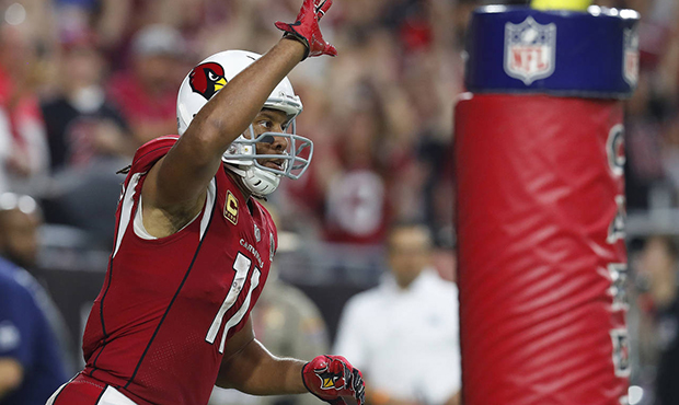 Arizona Cardinals wide receiver Larry Fitzgerald (11) celebrates his touchdown catch against the Sa...