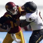 Southern California quarterback Jack Sears, left, is tackled by Arizona State linebacker Merlin Robertson during the first half of an NCAA college football game Saturday, Oct. 27, 2018, in Los Angeles. (AP Photo/Marcio Jose Sanchez)