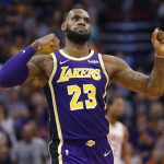 Los Angeles Lakers forward LeBron James (23) celebrates a basket against the Phoenix Suns during the second half of an NBA basketball game, Wednesday, Oct. 24, 2018, in Phoenix. (AP Photo/Matt York)