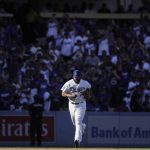 Los Angeles Dodgers relief pitcher Kenley Jansen runs toward the mound to pitch against the Colorado Rockies during the ninth inning of a tiebreaker baseball game, Monday, Oct. 1, 2018, in Los Angeles. (AP Photo/Jae C. Hong)