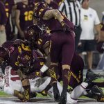 Stanford's JJ Arcega-Whiteside gets smothered by a slew of Arizona State defenders during the first half of an NCAA college football game Thursday, Oct. 18, 2018, in Tempe, Ariz. (AP Photo/Darryl Webb)