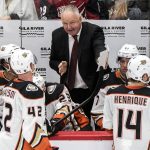 Anaheim Ducks coach Randy Carlyle talks to his team during the third period of an NHL hockey game against the Arizona Coyotes on Saturday, Oct. 6, 2018, in Glendale, Ariz. (AP Photo/Darryl Webb)