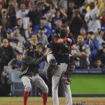 From left, Boston Red Sox's David Price, catcher Christian Vazquez and Chris Sale celebrate after Game 5 of baseball's World Series against the Los Angeles Dodgers on Sunday, Oct. 28, 2018, in Los Angeles. The Red Sox won 5-1 to win the series 4 game to 1. (AP Photo/Mark J. Terrill)