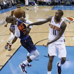 Oklahoma City Thunder guard Dennis Schroder (17) loses control of the ball after a foul by Phoenix Suns guard Jamal Crawford (11) in the first half of an NBA basketball game in Oklahoma City, Sunday, Oct. 28, 2018. (AP Photo/Sue Ogrocki)