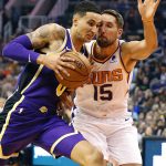 Los Angeles Lakers forward Kyle Kuzma (0) drives past Phoenix Suns forward Ryan Anderson (15) during the first half of an NBA basketball game, Wednesday, Oct. 24, 2018, in Phoenix. (AP Photo/Matt York)