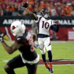 Denver Broncos wide receiver Emmanuel Sanders (10) throws for a touchdown against the Arizona Cardinals during the first half of an NFL football game, Thursday, Oct. 18, 2018, in Glendale, Ariz. (AP Photo/Rick Scuteri)