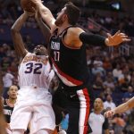 Portland Trail Blazers center Jusuf Nurkic blocks the shot of Phoenix Suns guard Davon Reed (32) during the second half of an NBA preseason basketball game, Friday, Oct. 5, 2018, in Phoenix. (AP Photo/Rick Scuteri)