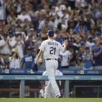 Los Angeles Dodgers starting pitcher Walker Buehler acknowledges the fans as he walks off the field after being relieved during the sixth inning of a tiebreaker baseball game against the Colorado Rockies, Monday, Oct. 1, 2018, in Los Angeles. (AP Photo/Jae C. Hong)