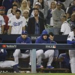 Los Angeles Dodgers' Yasiel Puig, right, and his teammates watches the eighth inning in Game 5 of the World Series baseball game against the Boston Red Sox on Sunday, Oct. 28, 2018, in Los Angeles. (AP Photo/David J. Phillip)