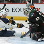 Arizona Coyotes goaltender Antti Raanta (32) makes the save on Buffalo Sabres center Tage Thompson during the third period of an NHL hockey game Saturday, Oct. 13, 2018, in Glendale, Ariz. (AP Photo/Rick Scuteri)