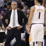 Phoenix Suns head coach Igor Kokoskov watches as guard Devin Booker (1) takes himself out of the game after an injury during the second half of an NBA basketball game against the Los Angeles Lakers, Wednesday, Oct. 24, 2018, in Phoenix. (AP Photo/Matt York)