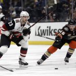 Arizona Coyotes' Oliver Ekman-Larsson (23) is defended by Anaheim Ducks' Ben Street (46) during the first period of an NHL hockey game Wednesday, Oct. 10, 2018, in Anaheim, Calif. (AP Photo/Marcio Jose Sanchez)