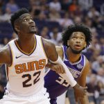 Phoenix Suns center Deandre Ayton (22) boxes out Sacramento Kings forward Marvin Bagley III, right, during the first half of a preseason NBA basketball game Monday, Oct. 1, 2018, in Phoenix. (AP Photo/Ross D. Franklin)