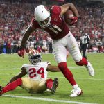 Arizona Cardinals wide receiver Larry Fitzgerald (11) scores a two point conversion as San Francisco 49ers defensive back K'Waun Williams (24) defends during the second half of an NFL football game, Sunday, Oct. 28, 2018, in Glendale, Ariz. The Cardinals won 18-15. (AP Photo/Ralph Freso)