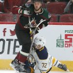 Arizona Coyotes defenseman Niklas Hjalmarsson and Buffalo Sabres center Tage Thompson (72) collide in the first period during an NHL hockey game, Saturday, Oct. 13, 2018, in Glendale, Ariz. (AP Photo/Rick Scuteri)
