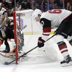 Anaheim Ducks goaltender John Gibson, left, stops a shot from Arizona Coyotes' Lawson Crouse (67) during the first period of an NHL hockey game Wednesday, Oct. 10, 2018, in Anaheim, Calif. (AP Photo/Marcio Jose Sanchez)