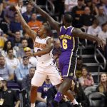 Phoenix Suns guard Isaiah Canaan slips past Los Angeles Lakers guard Lance Stephenson (6) for two during the first half of an NBA basketball game, Wednesday, Oct. 24, 2018, in Phoenix. (AP Photo/Matt York)
