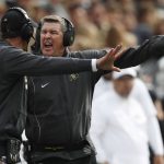 Colorado head coach Mike MacIntyre, back, yells at defensive coordinator D.J. Eliot in the first half of an NCAA college football game against Arizona State Saturday, Oct. 6, 2018, in Boulder, Colo. (AP Photo/David Zalubowski)