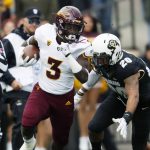 Arizona State running back Eno Benjamin, front, runs for a long gain as Colorado linebacker Drew Lewis pursues in the first half of an NCAA college football game Saturday, Oct. 6, 2018, in Boulder, Colo. (AP Photo/David Zalubowski)