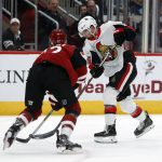 Ottawa Senators center Colin White (36) shoots in front of Arizona Coyotes defenseman Jordan Oesterle in the first period during an NHL hockey game, Tuesday, Oct. 30, 2018, in Glendale, Ariz. (AP Photo/Rick Scuteri)