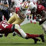 San Francisco 49ers running back Alfred Morris (46) is hit by Arizona Cardinals linebacker Haason Reddick (43) and free safety Antoine Bethea (41) during the second half of an NFL football game, Sunday, Oct. 28, 2018, in Glendale, Ariz. (AP Photo/Rick Scuteri)