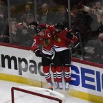 Chicago Blackhawks defenseman Erik Gustafsson, right, celebrates his goal against the Arizona Coyotes with center Jonathan Toews, left, during the second period of an NHL hockey game Thursday, Oct. 18, 2018, in Chicago. (AP Photo/David Banks)
