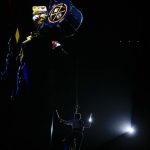 Denver Nuggets mascot Rocky and a drummer enter the arena from the roof before an NBA basketball game against the Phoenix Suns, Saturday, Oct. 20, 2018, in Denver. (AP Photo/Jack Dempsey)