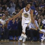 Golden State Warriors' Stephen Curry celebrates after scoring against the Phoenix Suns during the first half of a preseason NBA basketball game Monday, Oct. 8, 2018, in Oakland, Calif. (AP Photo/Ben Margot)