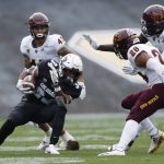 Colorado running back Travon McMillian, front left, is trapped after short gain by Arizona State defensive back Demonte King, from right, defensive lineman Jalen Bates, back left, and safety Jalen Harvey, back left, in the first half of an NCAA college football game, Saturday, Oct. 6, 2018, in Boulder, Colo. (AP Photo/David Zalubowski)