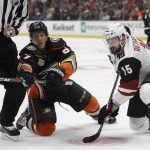 Anaheim Ducks' Rickard Rakell, left, faces off against Arizona Coyotes' Brad Richardson (15) during the second period of an NHL hockey game Wednesday, Oct. 10, 2018, in Anaheim, Calif. (AP Photo/Marcio Jose Sanchez)