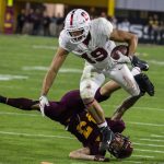 Stanford's JJ Arcega-Whiteside gets tripped up by Arizona State's Jalen Harvey during the second half of an NCAA college football game Thursday, Oct. 18, 2018, in Tempe, Ariz. (AP Photo/Darryl Webb)
