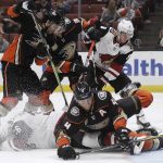 Anaheim Ducks' Cam Fowler .bottom right, collides with Arizona Coyotes' Christian Fischer, bottom left, during the first period of an NHL hockey game Wednesday, Oct. 10, 2018, in Anaheim, Calif. (AP Photo/Marcio Jose Sanchez)