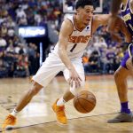 Phoenix Suns guard Devin Booker (1) drives against the Los Angeles Lakers during the second half of an NBA basketball game, Wednesday, Oct. 24, 2018, in Phoenix. (AP Photo/Matt York)