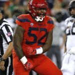 Arizona defensive tackle PJ Johnson (52) reacts after making a tackle for a loss against Oregon in the first half during an NCAA college football game, Saturday, Oct. 27, 2018, in Tucson, Ariz. (AP Photo/Rick Scuteri)