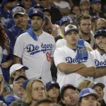 Los Angeles Dodgers fans watch during the eighth inning in Game 5 of the World Series baseball game against the Boston Red Sox on Sunday, Oct. 28, 2018, in Los Angeles. (AP Photo/Jae C. Hong)