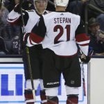 Arizona Coyotes' Christian Fischer, left, celebrates his goal against the Columbus Blue Jackets during the third period of an NHL hockey game Tuesday, Oct. 23, 2018, in Columbus, Ohio. The Coyotes beat the Blue Jackets 4-1. (AP Photo/Jay LaPrete)