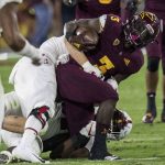 Arizona State's Eno Benjamin gets tackled by Stanford's Michael Williams during the first half of an NCAA college football game Thursday, Oct. 18, 2018, in Tempe, Ariz. (AP Photo/Darryl Webb)
