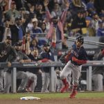 Boston Red Sox's Mookie Betts rounds the bases after a home run during the sixth inning in Game 5 of the World Series baseball game against the Los Angeles Dodgers on Sunday, Oct. 28, 2018, in Los Angeles. (AP Photo/Mark J. Terrill)