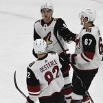 Arizona Coyotes' Lawson Crouse (67) celebrates his goal against the Chicago Blackhawks with Clayton Keller (9) and Jordan Oesterle (82) during the first period of an NHL hockey game Thursday, Oct. 18, 2018, in Chicago. (AP Photo/David Banks)