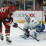 Arizona Coyotes right wing Christian Fischer (36) shoots against Vancouver Canucks goaltender Anders Nilsson in the second period during an NHL hockey game, Thursday, Oct. 25, 2018, in Glendale, Ariz. (AP Photo/Rick Scuteri)