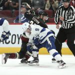 Tampa Bay Lightning's Tyler Johnson (9) and Arizona Coyotes' Derek Stepan battle for the puck during the second period of an NHL hockey game, Saturday, Oct. 27, 2018, in Glendale, Ariz. (AP Photo/Ralph Freso)