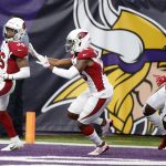 Arizona Cardinals strong safety Budda Baker, left, celebrates with teammates after returning a fumble 36-yards for a touchdown during the first half of an NFL football game against the Minnesota Vikings, Sunday, Oct. 14, 2018, in Minneapolis. (AP Photo/Bruce Kluckhohn)