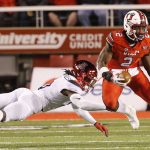 Utah running back Zack Moss (2) eludes Arizona safety Demetrius Flannigan-Fowles (6) during the first half during an NCAA college football game Friday, Oct. 12, 2018, in Salt Lake City. (AP Photo/Rick Bowmer)