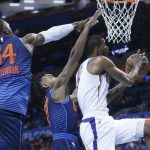 Phoenix Suns forward Trevor Ariza (3) goes to the basket in front of Oklahoma City Thunder forward Patrick Patterson (54) and guard Terrance Ferguson (23) in the first half of an NBA basketball game in Oklahoma City, Sunday, Oct. 28, 2018. (AP Photo/Sue Ogrocki)