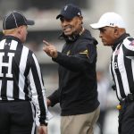Arizona State head coach Herm Edwards, center, confers with head linesman Bob Day, left, and referee Javarro Edwards in the first half of an NCAA college football game against Colorado Saturday, Oct. 6, 2018, in Boulder, Colo. (AP Photo/David Zalubowski)
