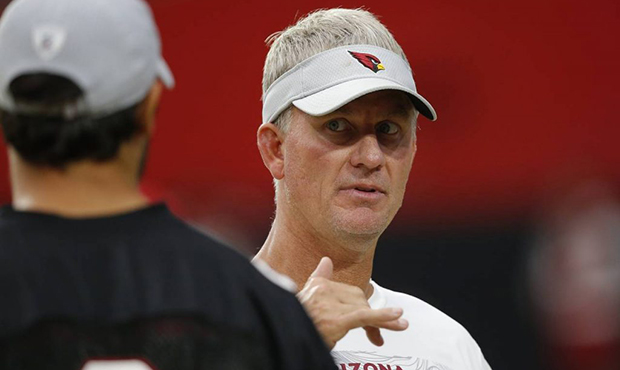 Arizona Cardinals offensive coordinator Mike McCoy, right, talks with Cardinals quarterback Sam Bra...