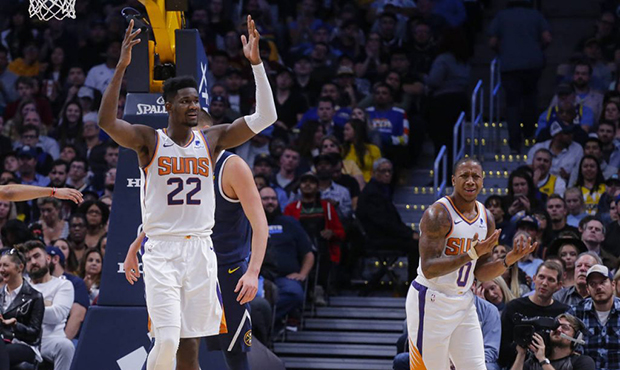 Phoenix Suns center Deandre Ayton (22) and Isaiah Canaan (0) react to a call during the second quar...