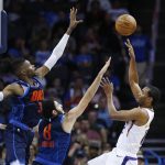 Phoenix Suns forward T.J. Warren, right, shoots as Oklahoma City Thunder forward Nerlens Noel (3) and Alex Abrines (8) defend in the second half of an NBA basketball game in Oklahoma City, Sunday, Oct. 28, 2018. (AP Photo/Sue Ogrocki)